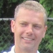 A headshot of Dave Tiss, Director of Development at Common App. He has short blonde hair and is smiling.