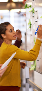 Woman writing on a white board